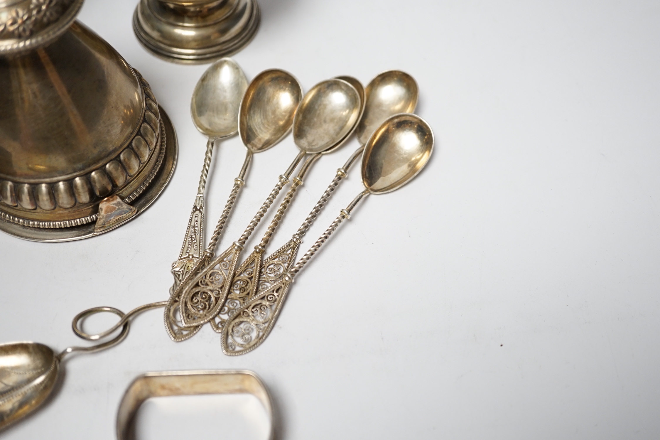 A silver sugar caster, serviette rings, a plated wine funnel, a Wedgwood biscuit barrel, etc.